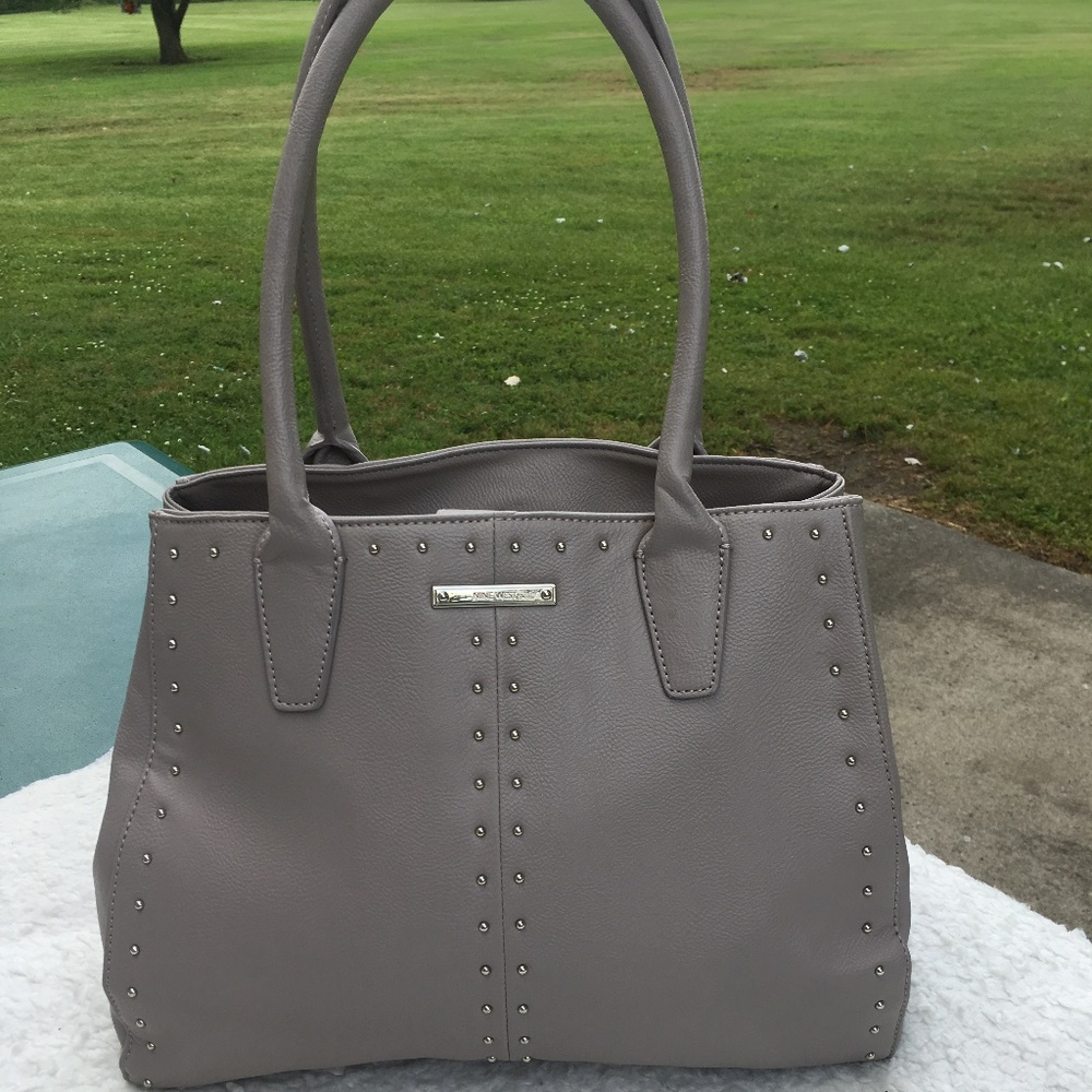 NINE WEST  TAN PURSE  WITH SILVER STUDDS